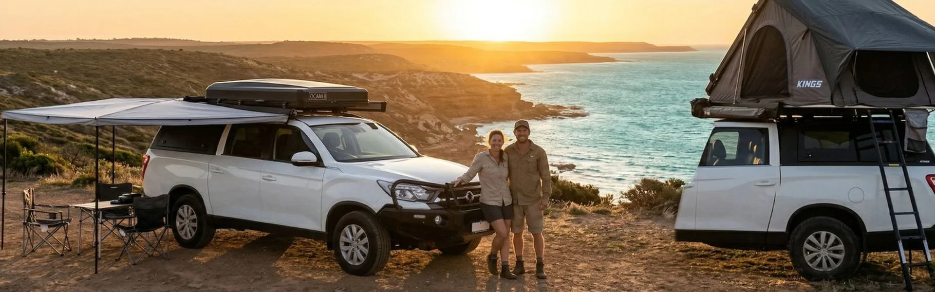 Couple enjoying sunset by their 4WD camper in Western Australia