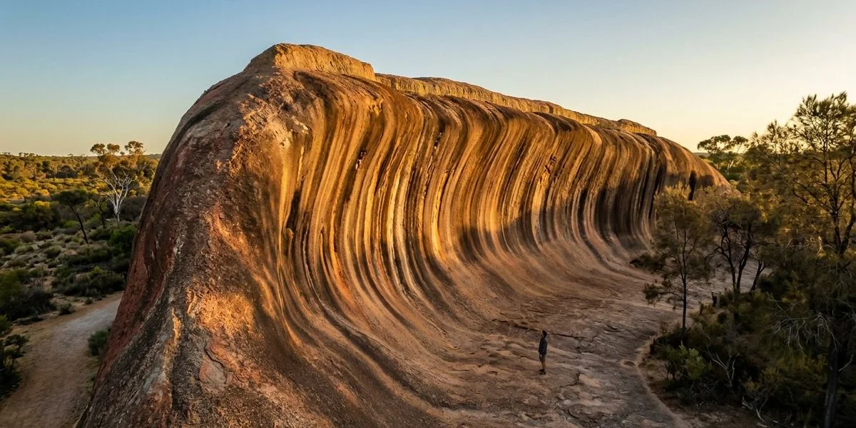 The iconic Wave Rock granite formation near Hyden Western Australia curving like a massive ocean wave frozen in red and grey stone